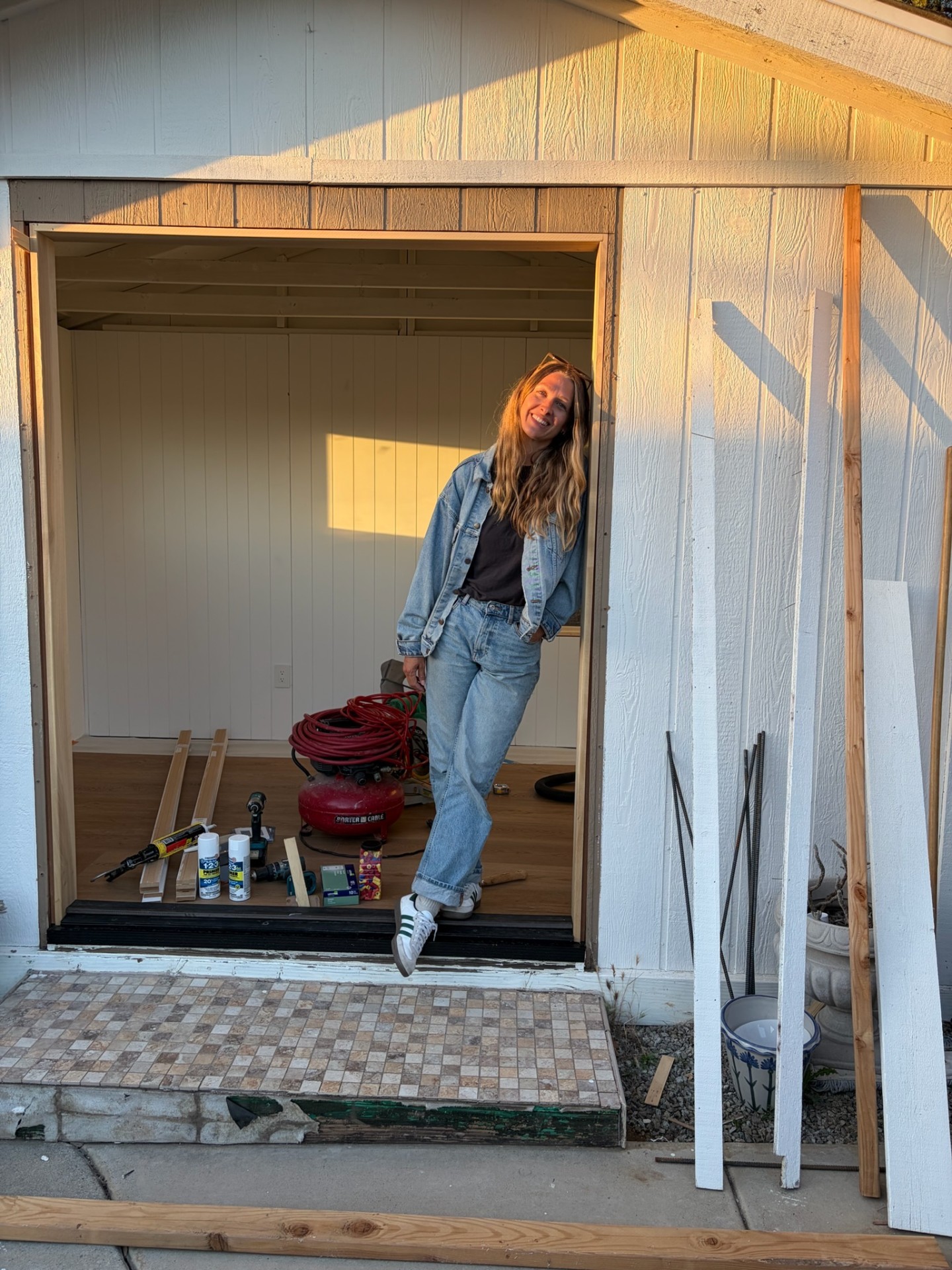 Chelsea standing in the unfinished Mudroom doorway during the buildout