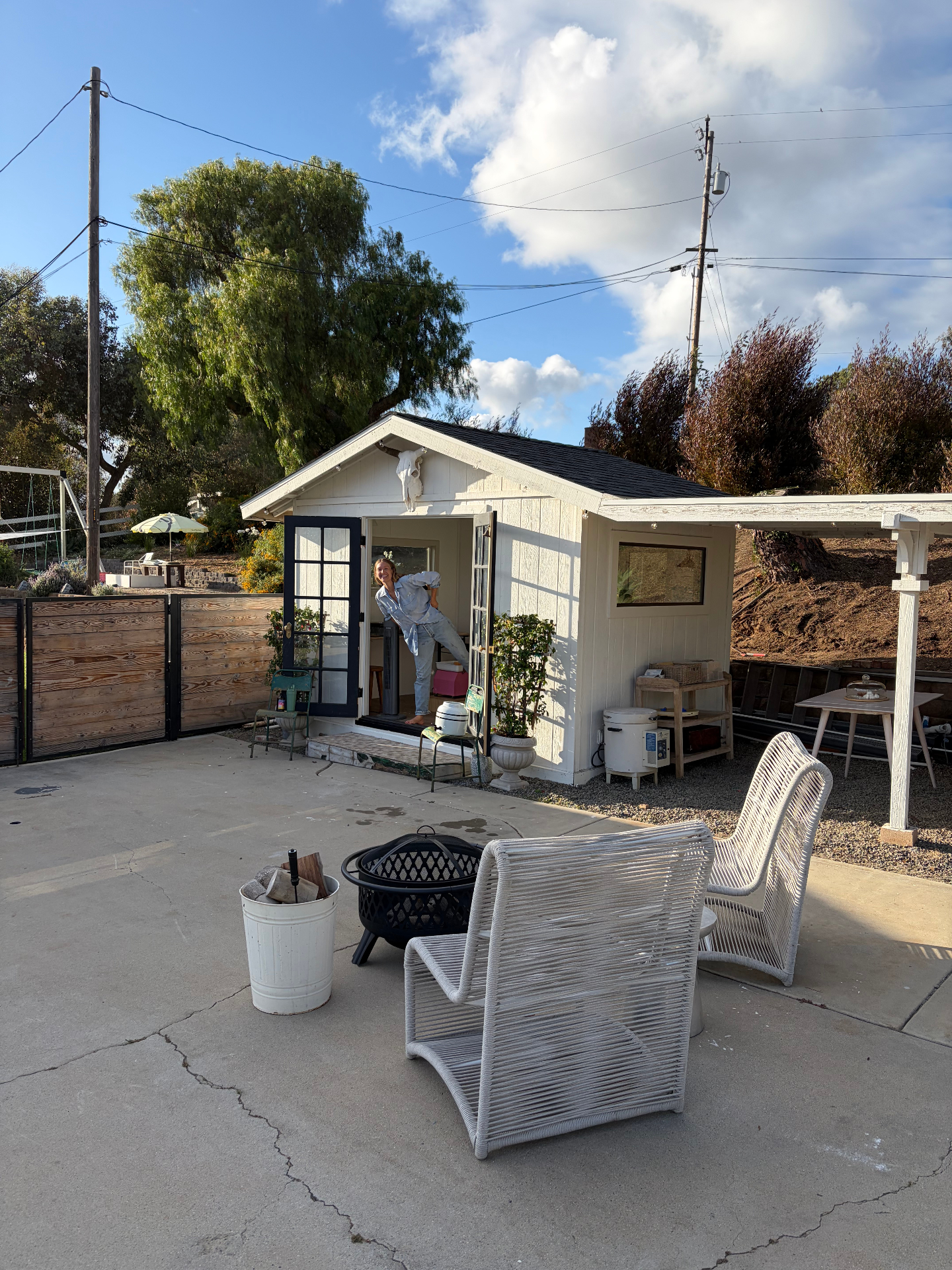 The Mudroom studio exterior with the doors open on a sunny afternoon