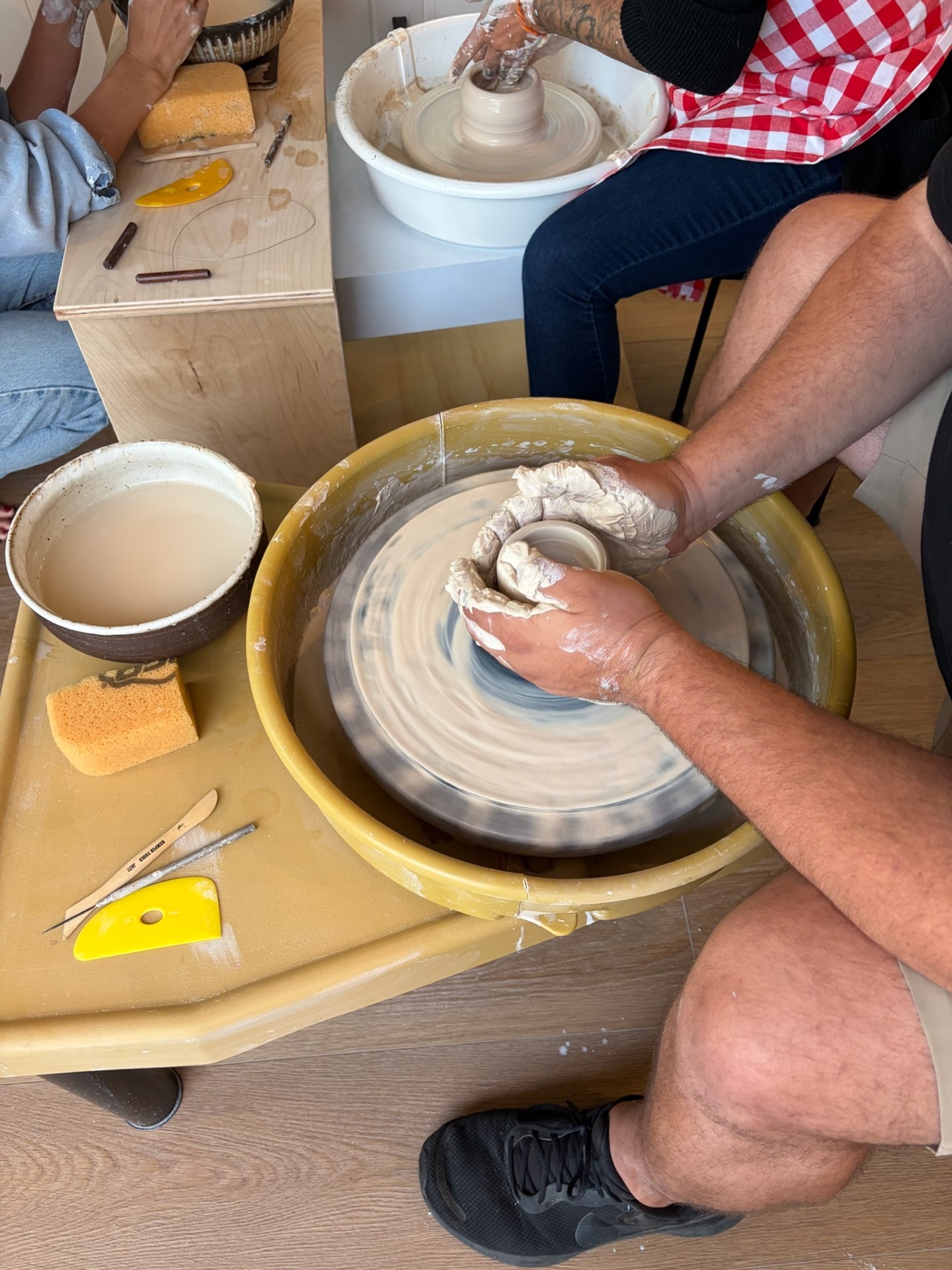Close-up of hands pulling a cylinder on the wheel